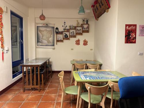 a dining room with two tables and chairs at Blue Bay in Green Island