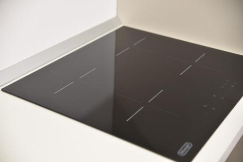 a drawer in a white counter top with a window at Loft Atenea in Agrigento