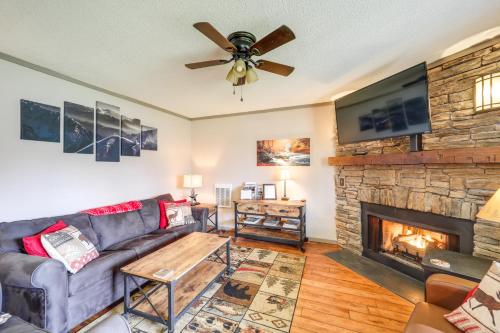 a living room with a couch and a fireplace at Furnished Deck and Resort Perks Beech Mtn Retreat! in Beech Mountain