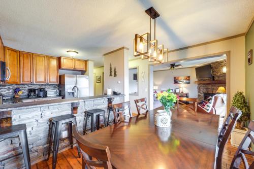 a kitchen and dining room with a long table and chairs at Furnished Deck and Resort Perks Beech Mtn Retreat! in Beech Mountain