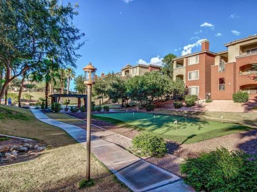 a golf course in a residential neighborhood with a street light at Gated Condo Heated Pool Spa Gym Near Zoo in Phoenix