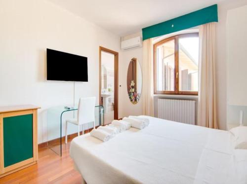 Säng eller sängar i ett rum på Villa Serra Alta