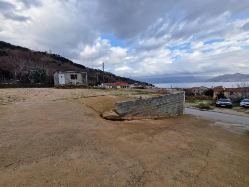 a brick wall sitting on the side of a road at APARTMENT NUNA in Baška