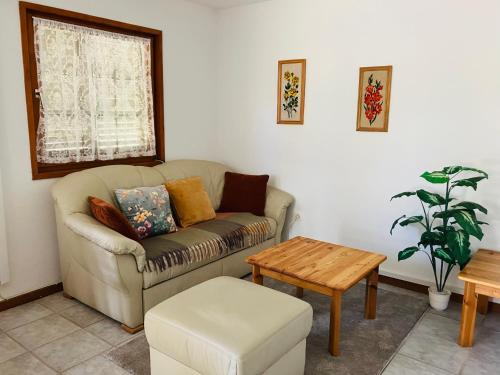 a living room with a couch and a table at Polzer CAMPING BÜKFÜRDŐ in Bük