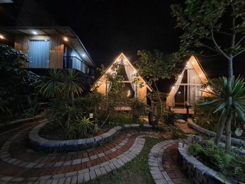 a house at night with a pathway in front of it at Bungalow HTC tuần châu in Ha Long
