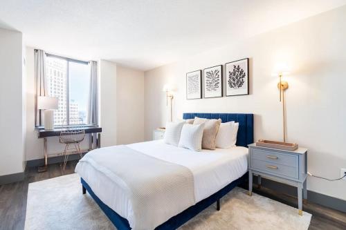 a bedroom with a large bed and a desk at Hartford Heights Skyline Views Await in Hartford