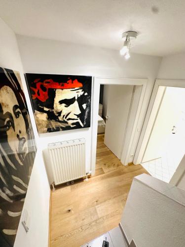 a room with paintings on the walls and a hallway at LUXURY STAY SALZBURG City in Salzburg