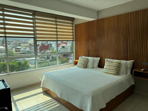 Postel nebo postele na pokoji v ubytování Hotel DABA