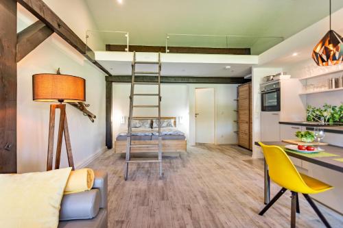 a room with a loft bed in a tiny house at Feichten Glück 16 in Siegsdorf