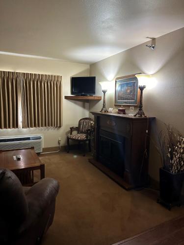 a living room with a couch and a fireplace at First Gold Gaming Resort in Deadwood