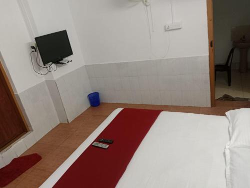 Kunnathoor Red castle vagamon tesisinde bir odada yatak veya yataklar