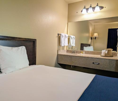 a hotel room with a bed and a sink at First Gold Gaming Resort in Deadwood