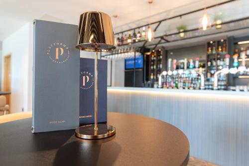 a lamp sitting on top of a table in a bar at Holiday Inn Blackpool by IHG in Blackpool