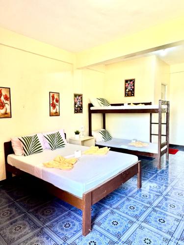 Ένα ή περισσότερα κρεβάτια σε δωμάτιο στο Edem Tourist Inn Malapascua
