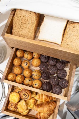 two wooden boxes filled with different types of bread at Holiday Inn Blackpool by IHG in Blackpool