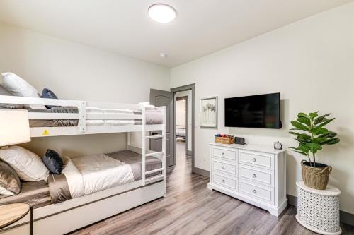 a bedroom with two bunk beds and a tv at Game Room and Patio Picturesque Home in Sonora in Sonora