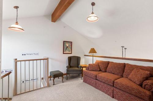a living room with a couch and a chair at Riverbend Lodge 217 by Great Western Lodging in Breckenridge