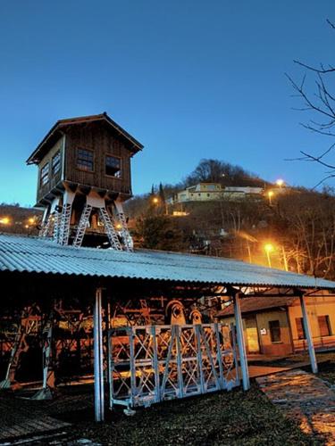 a building with a house on top of it at El Sumiciu in Mieres