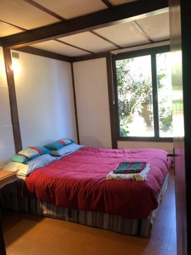 A bed or beds in a room at Casa Bosquemar