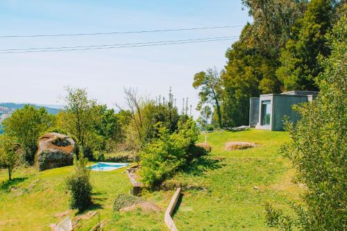 a house on a hill with a swimming pool at Just Like Home - Quinta de Todos os Dias in Paredes de Coura