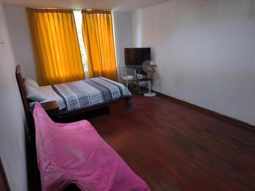 Ένα ή περισσότερα κρεβάτια σε δωμάτιο στο Sumaq Wasi Caminos Del Inca