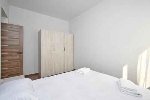Ένα ή περισσότερα κρεβάτια σε δωμάτιο στο Wizz Hotel