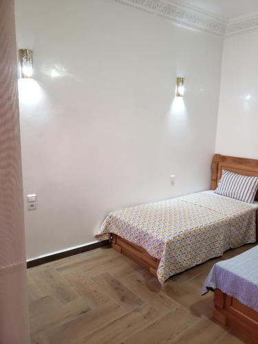 a bedroom with two beds in a room at villa najia in Oualidia