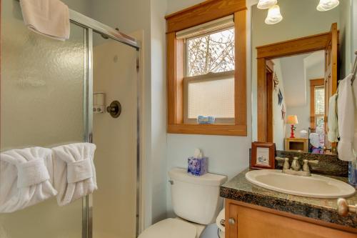 a bathroom with a toilet and a sink and a shower at Granby Cabin Rental on Fraser River - Fish and Ski! in Granby