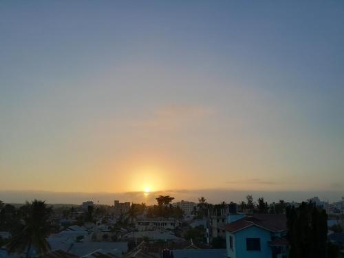 a sunset from the roof of a city at Graceful Listing in Mombasa