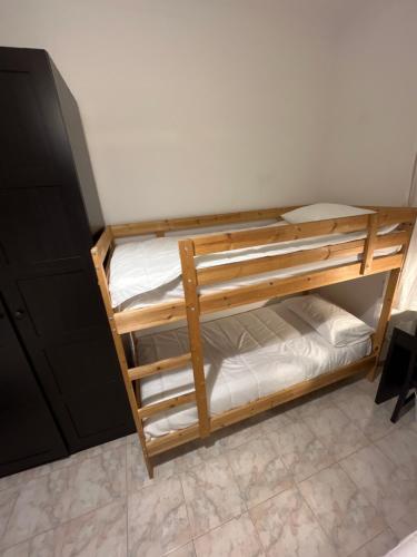 a couple of bunk beds in a room at Scalo 71 GUEST HOUSE in Rome
