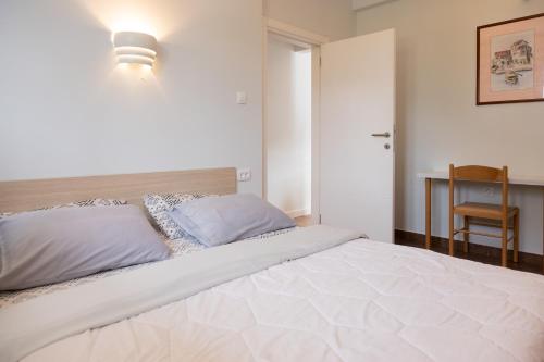 Ένα ή περισσότερα κρεβάτια σε δωμάτιο στο Apartments Djurovic