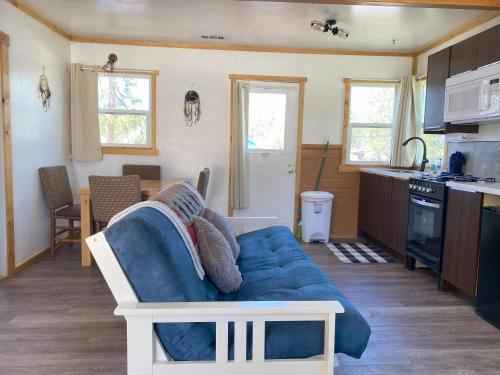 a living room with a blue couch in a kitchen at Blue Horizon Lodge in Big Bear Lake