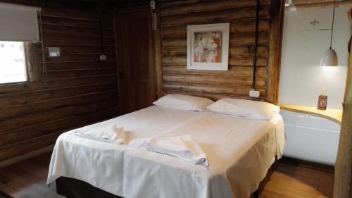 Un pat sau paturi într-o cameră la Posada Vanguardia