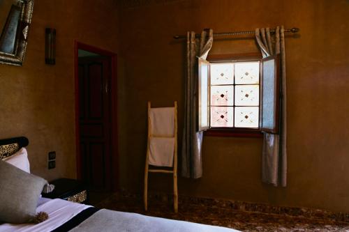 Katil atau katil-katil dalam bilik di Merzouga Riad Desert Man