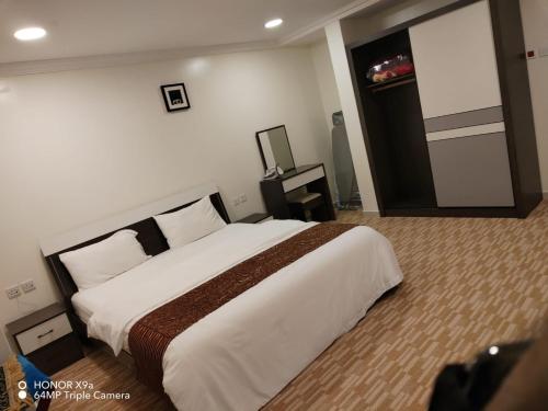 Voodi või voodid majutusasutuse Danat Layalina Apparthotel toas