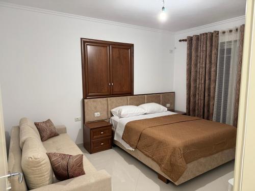 Postel nebo postele na pokoji v ubytování Daisy Apartment