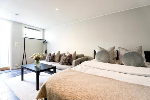 A bed or beds in a room at Apartment on idyllic Bygdøy with free parking