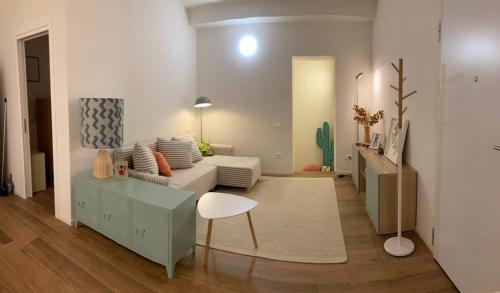 a living room with a couch and a table at Callegherie 21 Boutique B&B in Imola