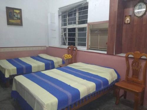 Ένα ή περισσότερα κρεβάτια σε δωμάτιο στο Casa en Pochutla de adobe con boveda catalana.