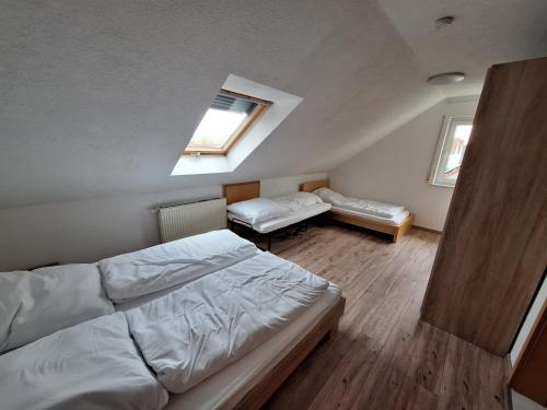 a bedroom with a bed and a skylight at FeWo BlackForest in Neuenburg am Rhein