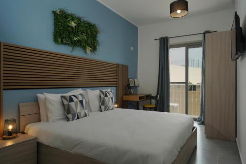 Ένα ή περισσότερα κρεβάτια σε δωμάτιο στο Modern 5-Bedroom Apartment Central Malta