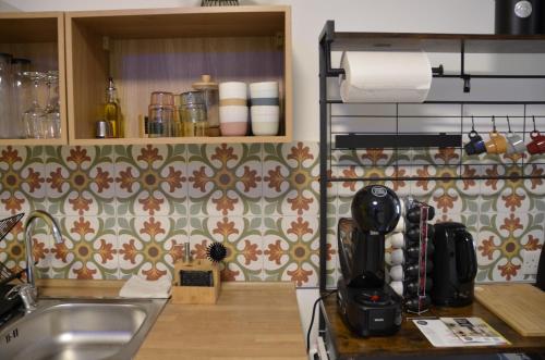 a kitchen with a sink and a counter top at Your Modern Comfort Home in Malta in Mosta