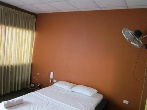 Voodi või voodid majutusasutuse Hospedaje Talareño Hokua Suite toas