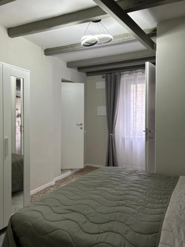 a bedroom with a large bed in a room at Timco apartment with big terrace, partial lake view and air-conditioner in Torno