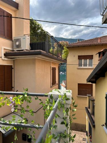 a view from a balcony of a building at Timco apartment with big terrace, partial lake view and air-conditioner in Torno