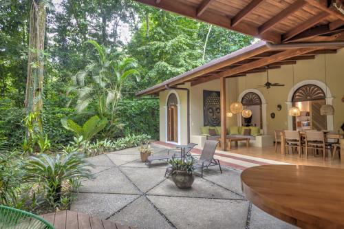 an outdoor patio with a table and chairs at Shawandha Villas in Punta Uva