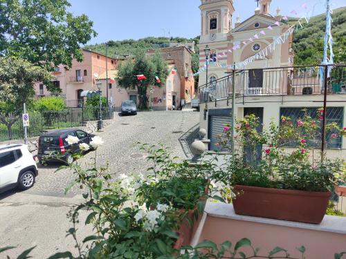 a street in a town with cars parked on the street at Camelia Vico Equense in Vico Equense