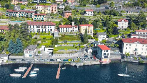 an aerial view of a town with boats in the water at Villa Luminosa Laglio - Private Parking, Garden in Laglio