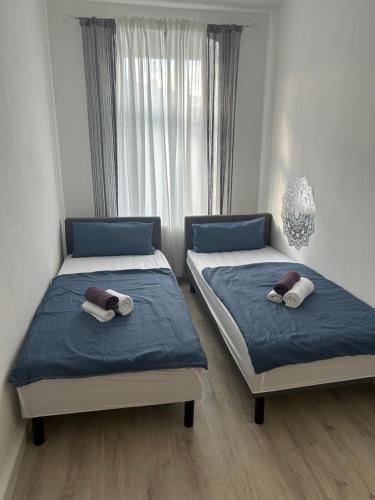 Ένα ή περισσότερα κρεβάτια σε δωμάτιο στο Apartment 3