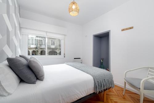 A bed or beds in a room at Ohana Home